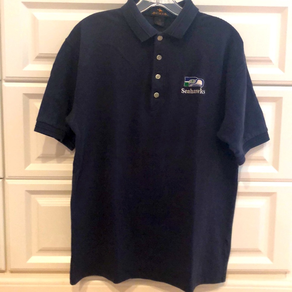 Seattle Seahawks 100% cotton, 4 buttons polo. Navy w/ retro team logo design